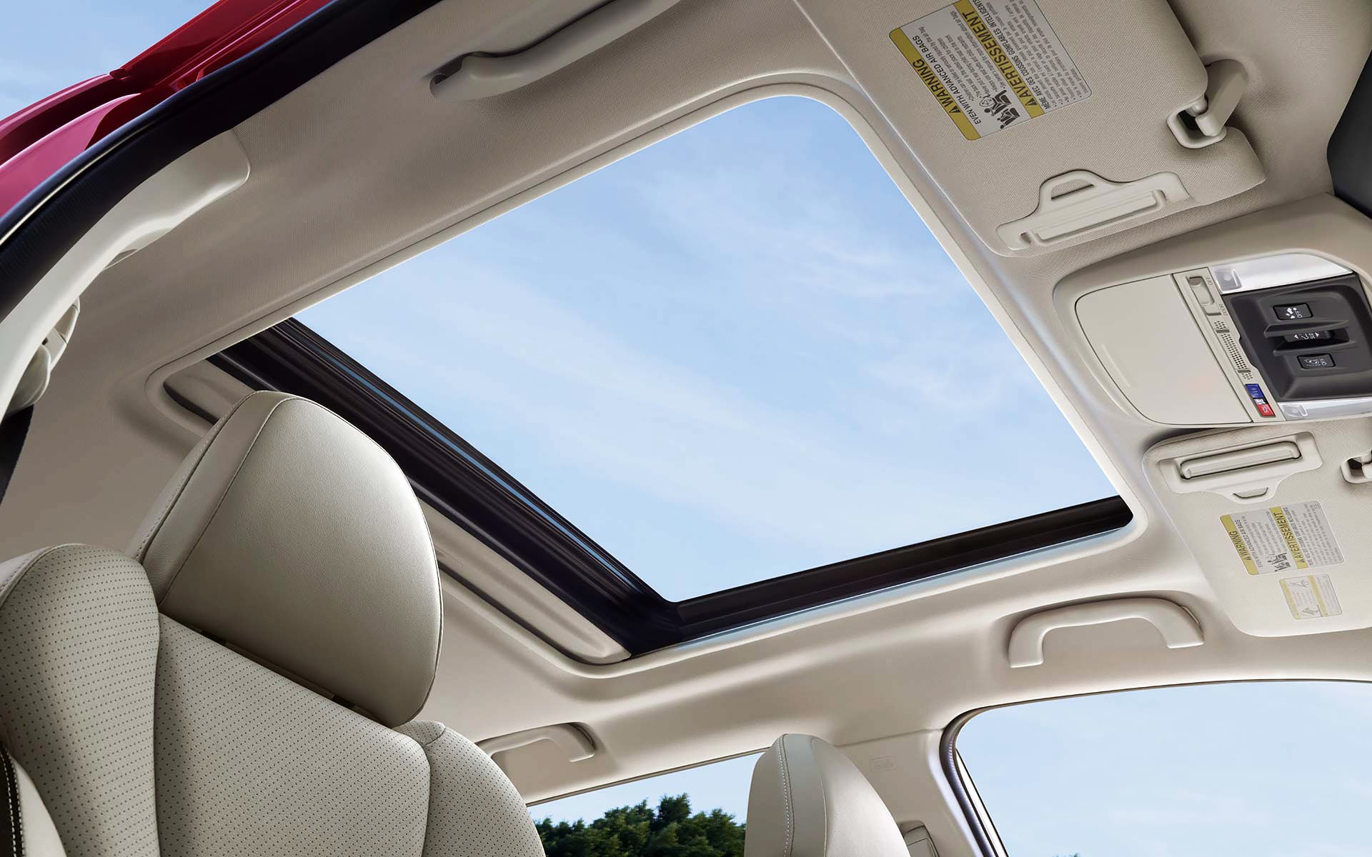 A view through the power sliding panoramic moonroof on the 2022 Forester Sport. | Island Subaru in Staten Island NY