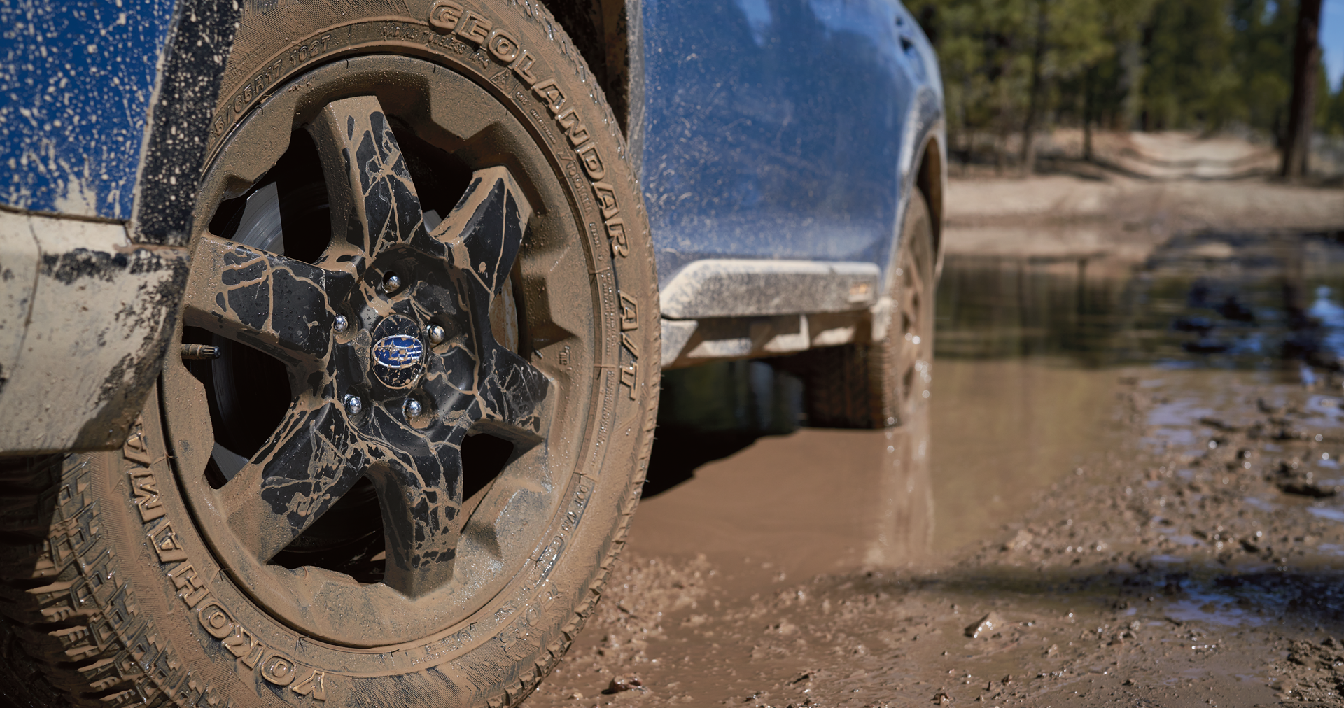 A close-up of the 17-inch off-road wheels and all-terrain Yokohama GEOLANDAR® tires on the 2023 Outback Wilderness. | Island Subaru in Staten Island NY